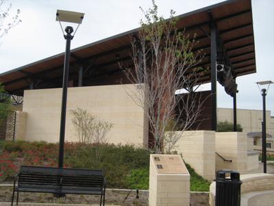 Commercial building entrance with brick pilasters and header details