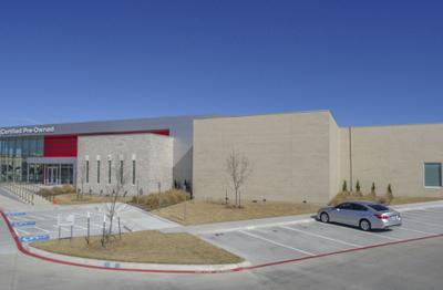 Service bay building showing CMU block construction with brick veneer