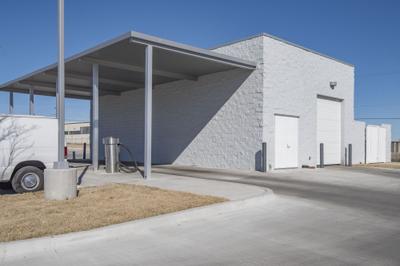 Showroom entrance featuring decorative brick coursework and modern signage integration