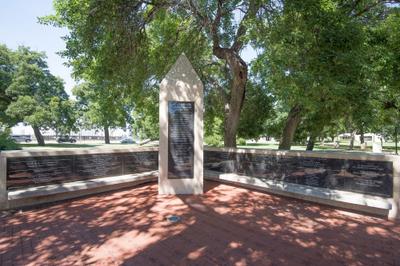 Memorial plaza featuring natural stone walls and commemorative brick pavers