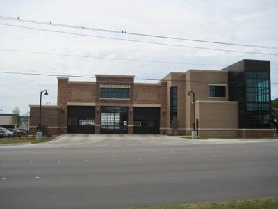Station entrance featuring decorative brick coursework and municipal signage