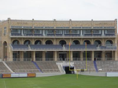 Stadium-side elevation with multi-story brick and limestone elements