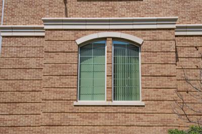 Building wing showing stacked bond CMU with brick veneer